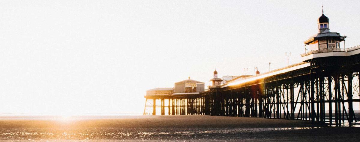 A Pier and Beach at Sunset in Lancashire