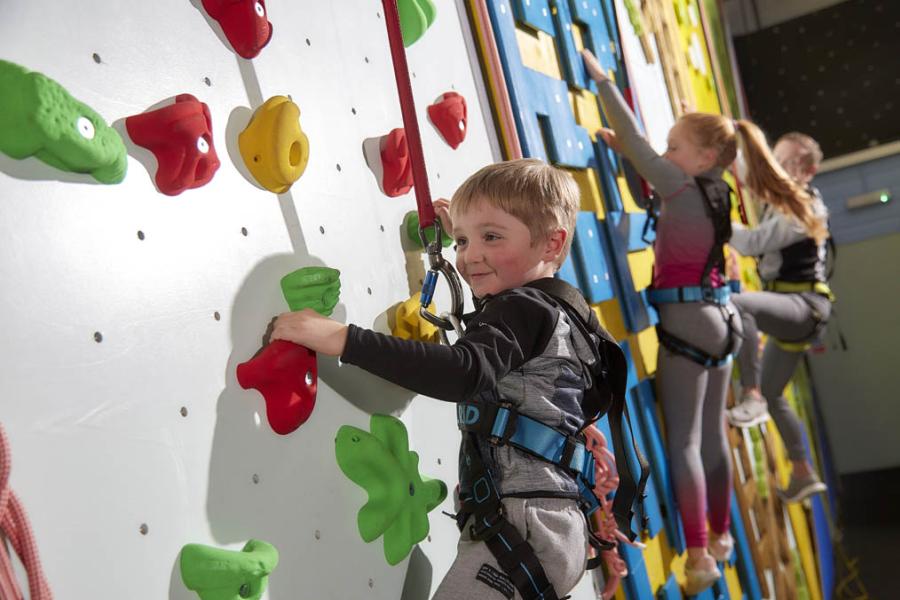 kids on the climbing wall at Warmwell Holiday Park