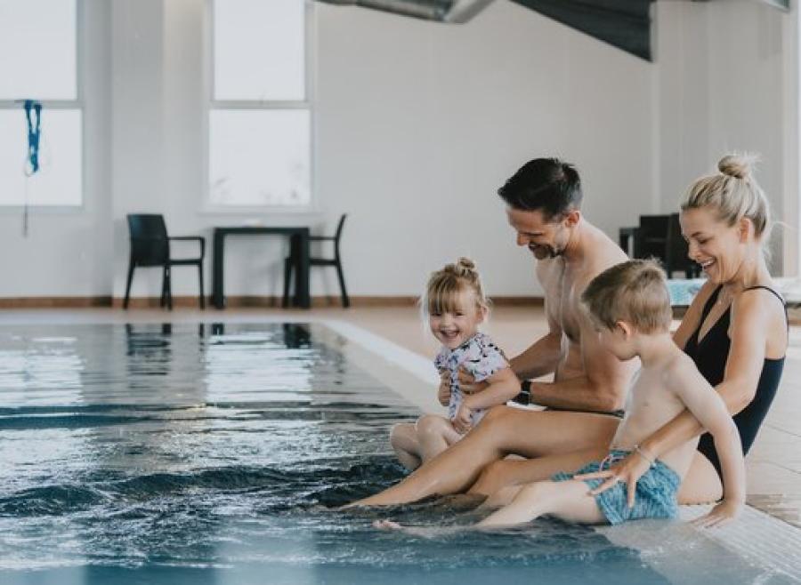 family by the swimming pool