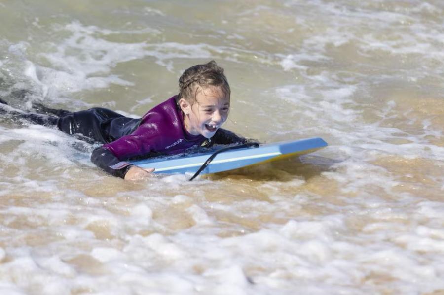 enjoyning the surf at Riviere Sands Holiday Park