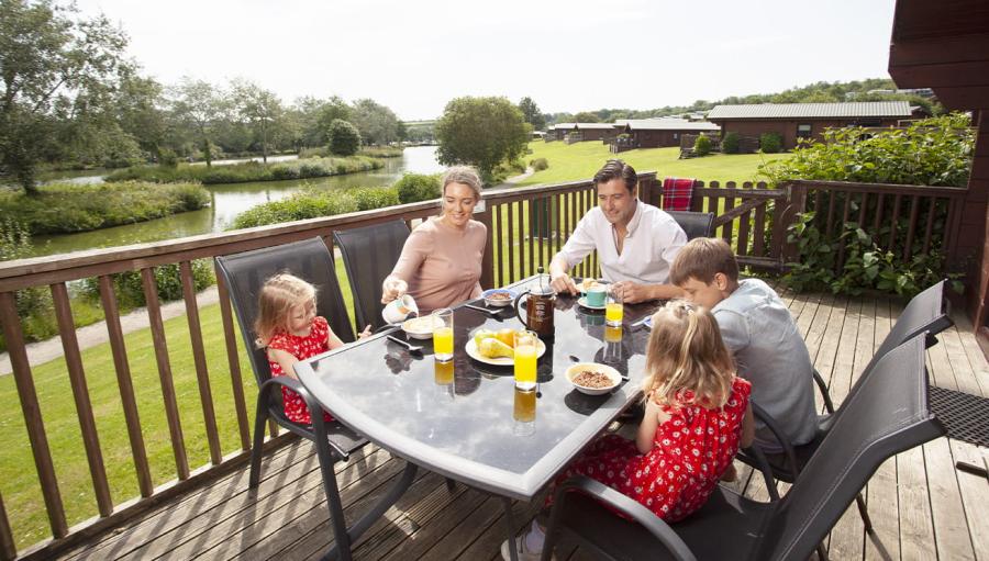 lodges overlooking the alkes at White Acres Holiday Park