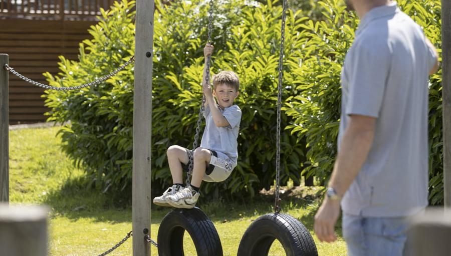 on the tyre swings at White Acres Holiday Park