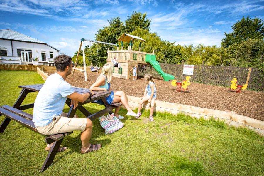 kids play area outside at Widemouth Bay Caravan Park