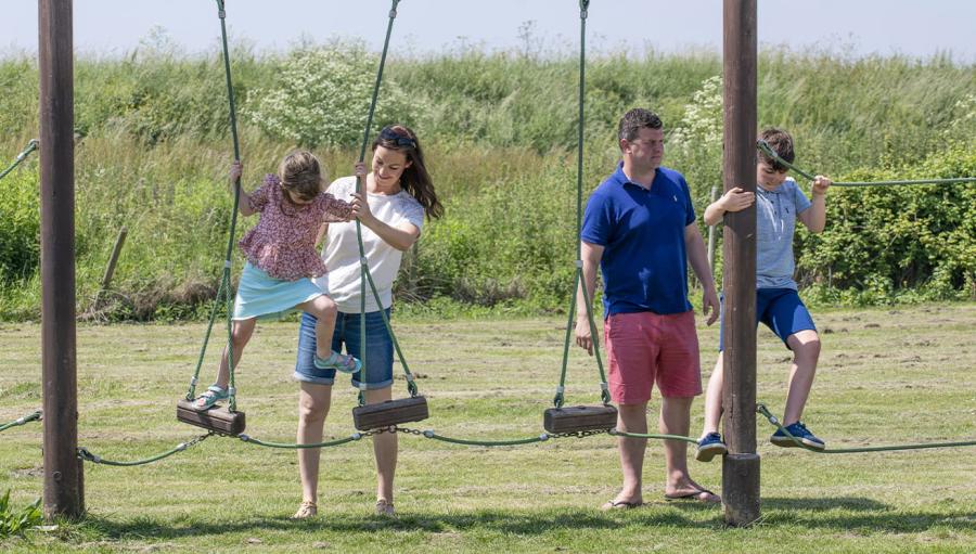 on the swings at Coopers Beach Holiday Park