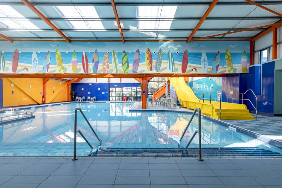 indoor pool with slides onsite at Dovercourt Holiday Park