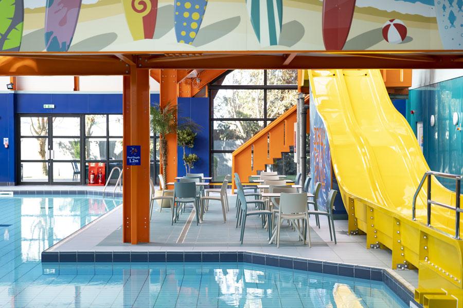 indoor pool with slides at Dovercourt Holiday Park