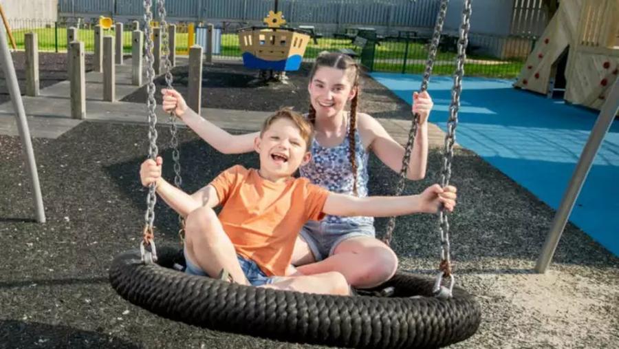 on the swings at Shorefield Country Park