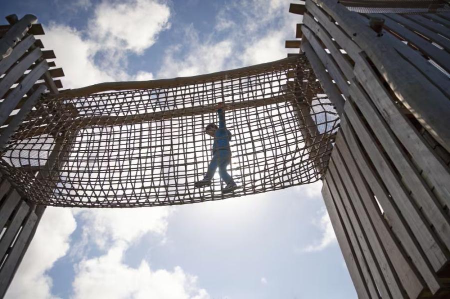 walkin gon the nets on the high rope course