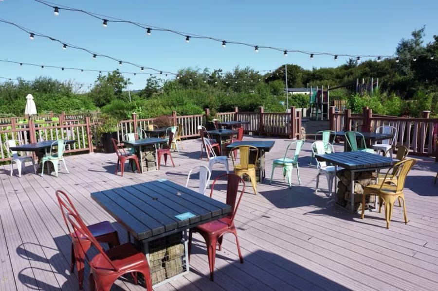 outside eating and drinking area at Cala Gran Holiday Park