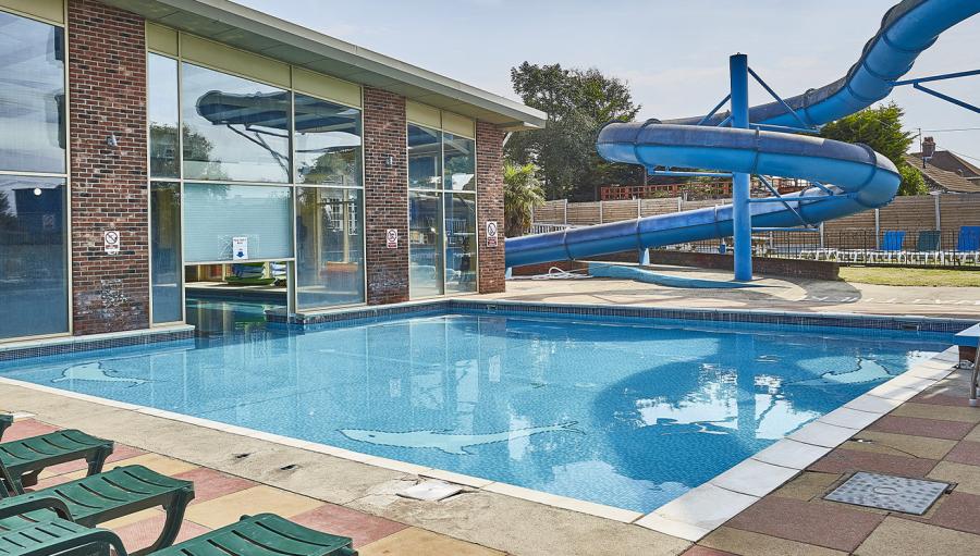 Highfield Grange Holiday Park outdoor swimming pool with flume