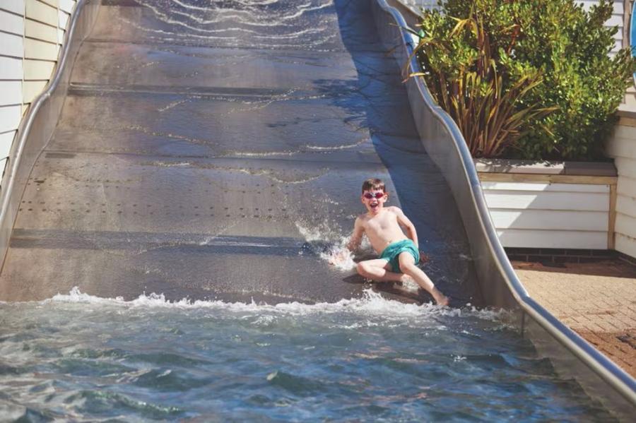 going down the slides at Blue Dolphin Caravan Park