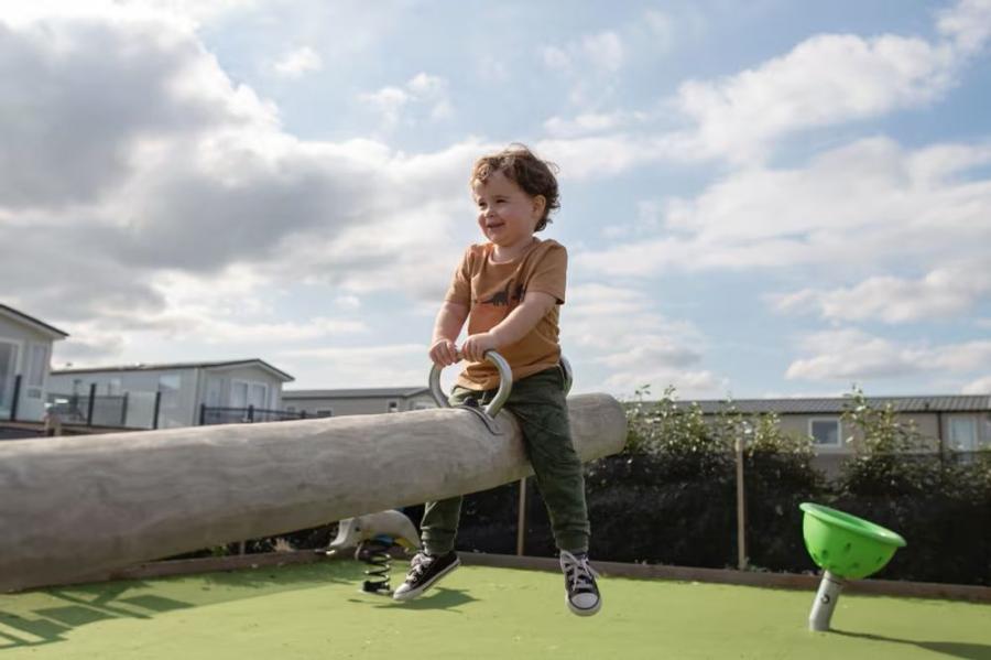 on the seasaw at Reighton Sands Holiday Park