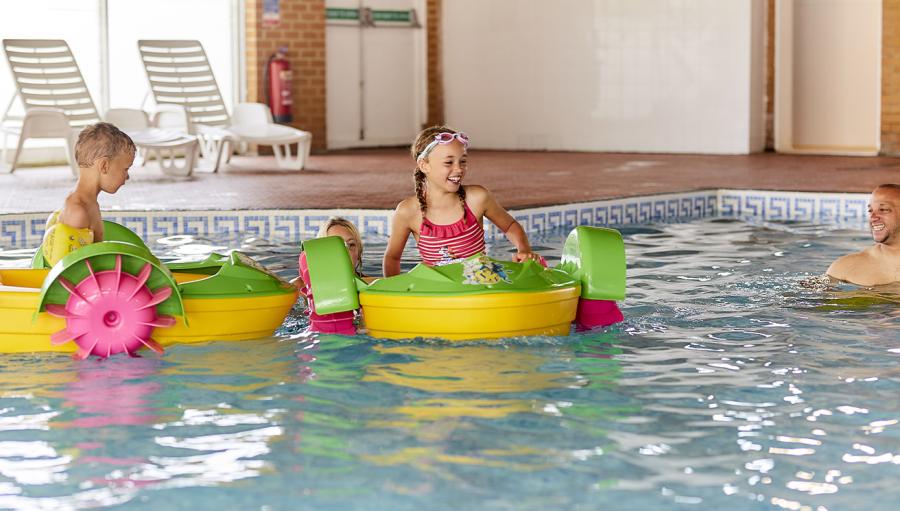 kids toddlers infaltables in the pool at Romney Sands Holiday Park