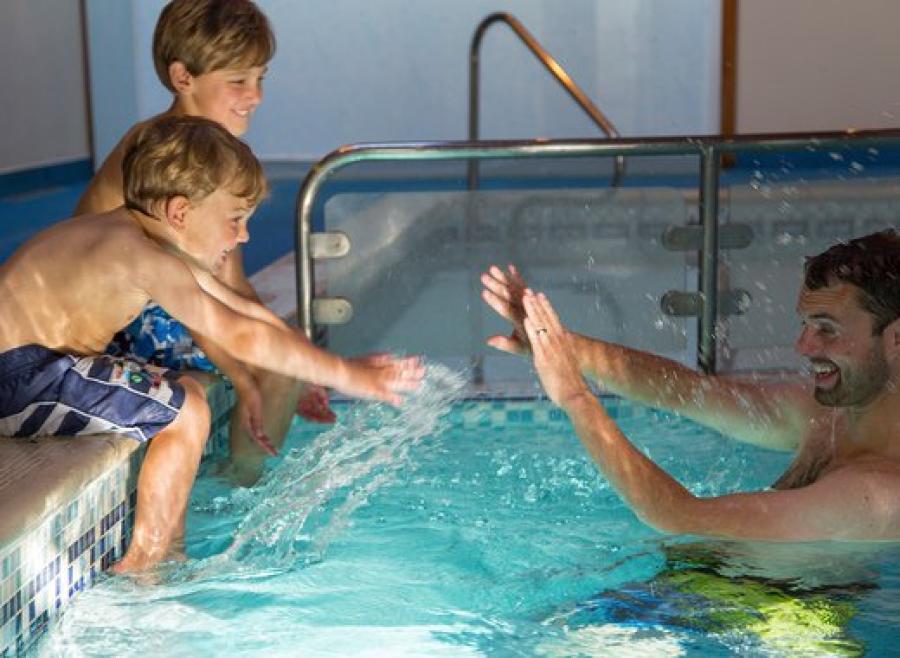 having fun in the pool on holiday