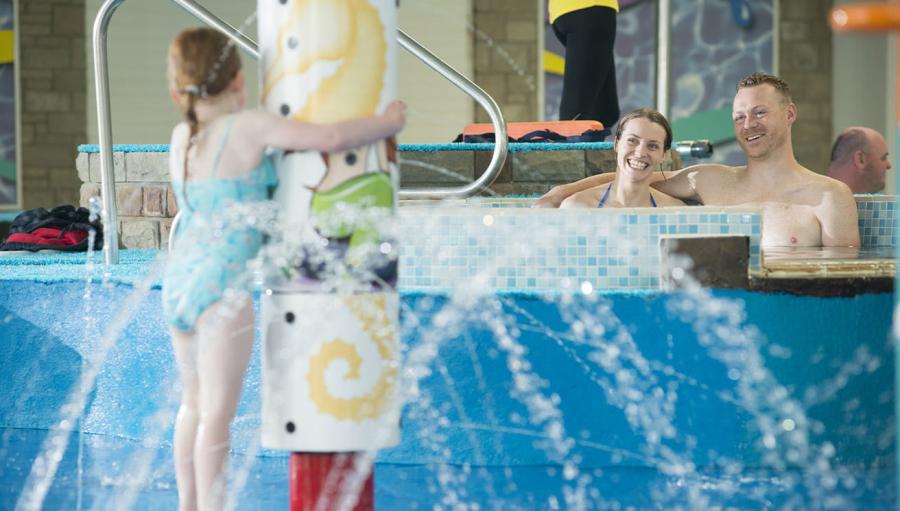 jacuzzi in the swimming pool area at Carmarthen Bay Holiday Park