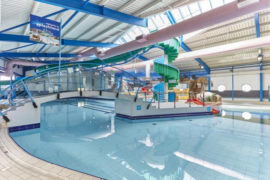 indoor pool with flumes at Treco Bay Holiday Park