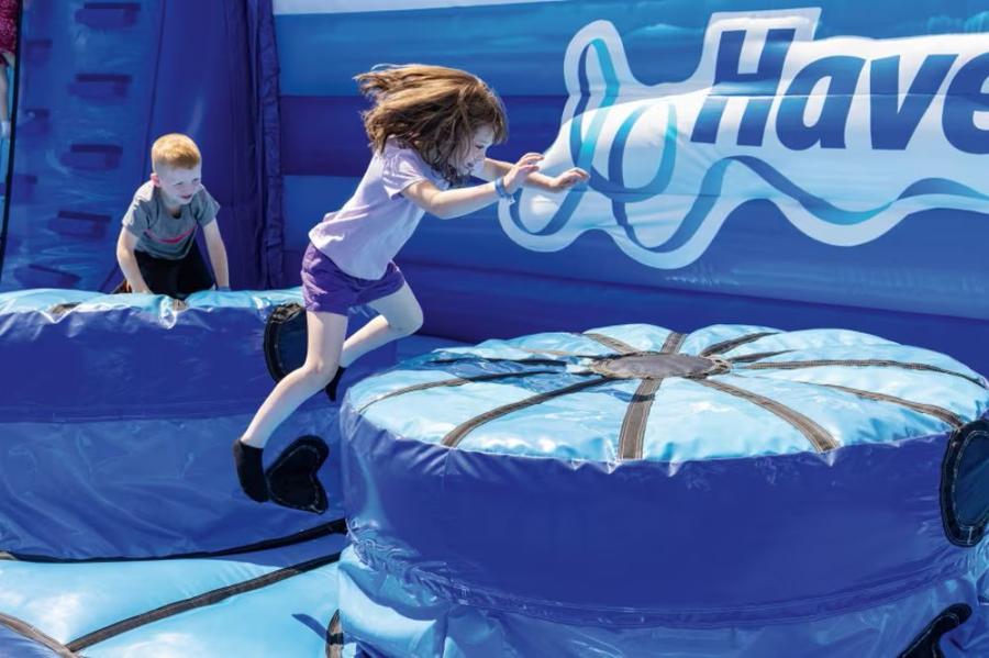 kids on the inflatable course at Haggerston Castle Holiday Park