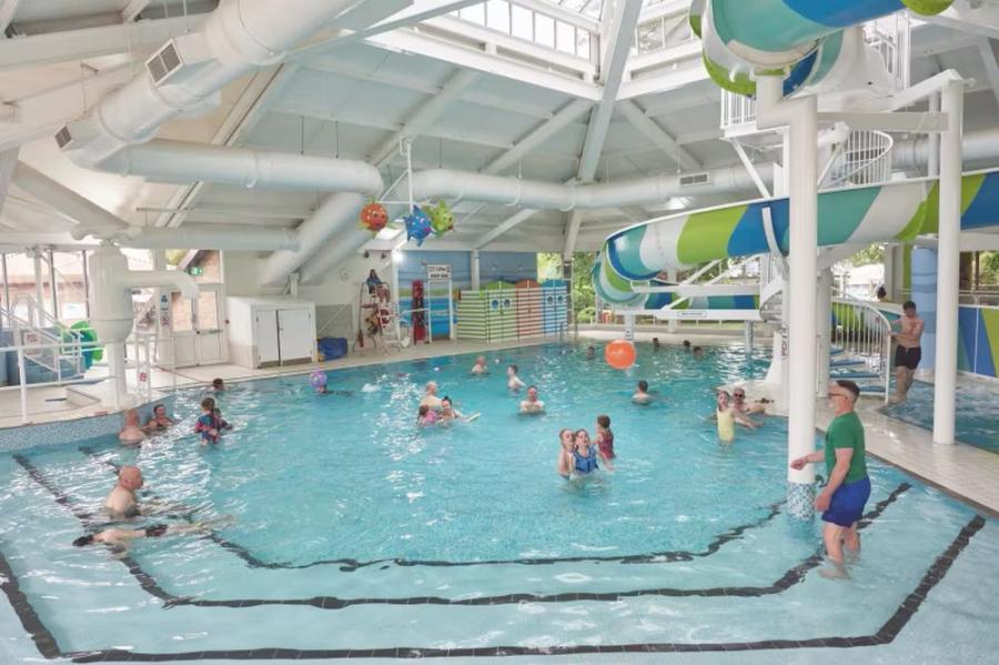 huge indoor swimming pool with slides at Hopton Holiday Village