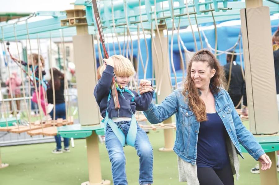 enjoying the swing ropes at Hopton Holiday Village