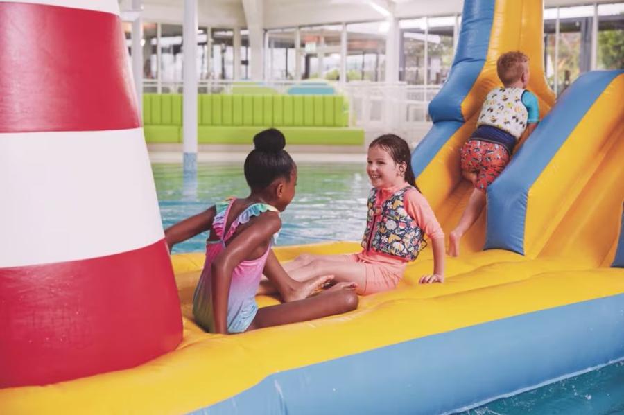 inflatables in the indoor pool at Hopton Holiday Village