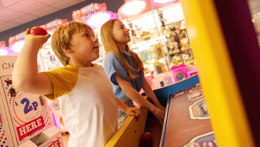 fun in the amusement arcade at Sandy Bay Holiday Park