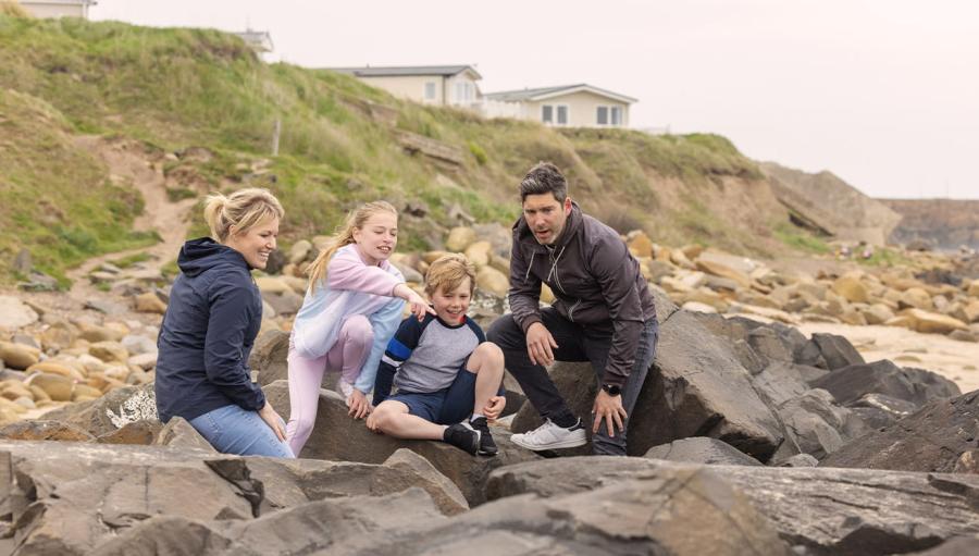 by the beach at Sandy Bay Holiday Park