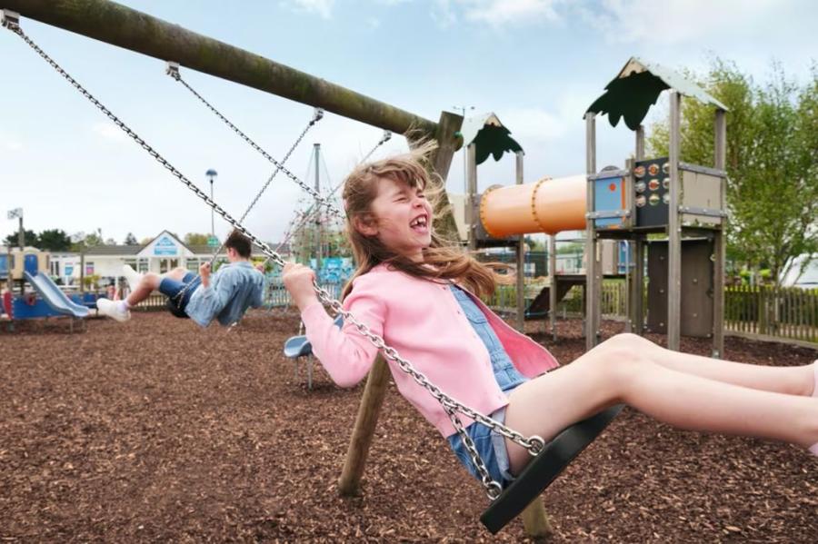 fun on the swings at Seashore Holiday Park