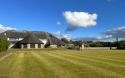 large grassy area outside the clubhouse