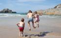 playing in the sand at Crantock Beach