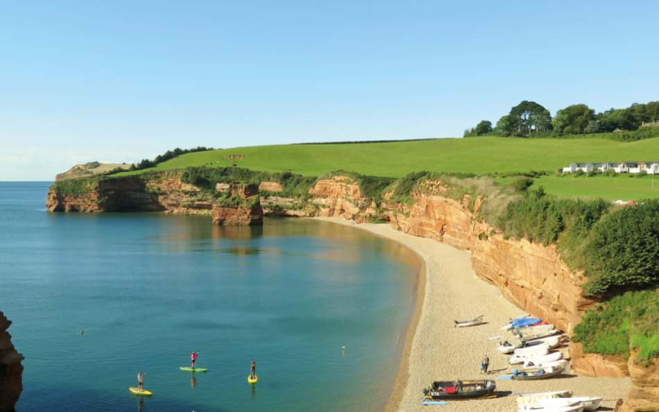 People Riding SUP's on the Sea in a Beautifully Shelteres Devonshire Cove