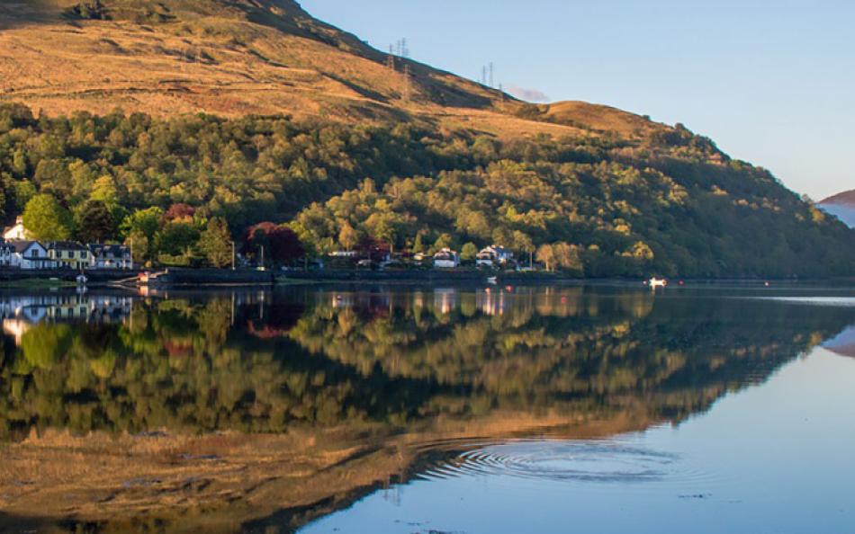 A view of a Village and Loch Lomond, great for family holidays