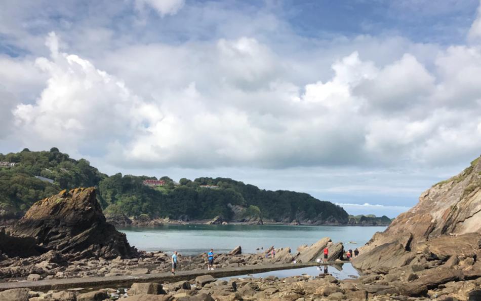 Families Exploring Rock Pools on a North Devon Beach