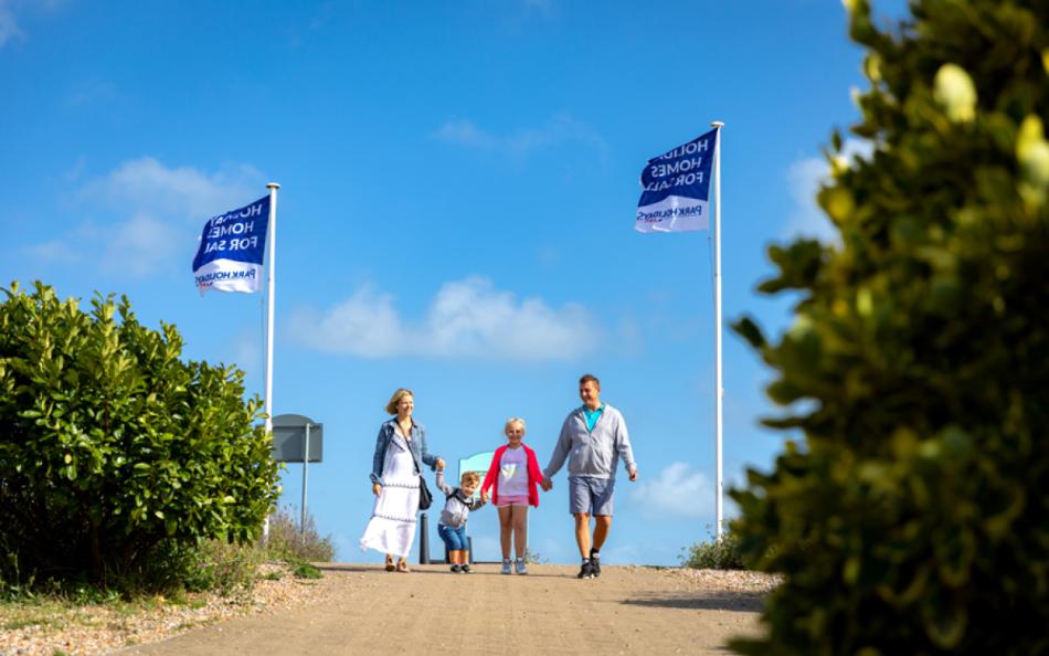 A Family Group Walking at Pevensey Bay Holiday Park Resort from Park Holidays UK