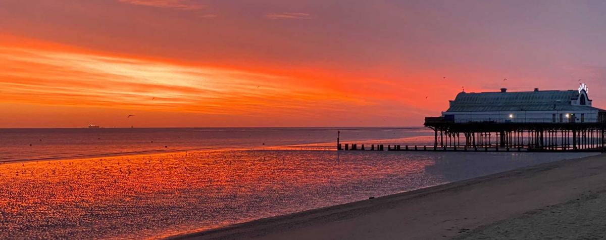 A sunset over the beach at Cleethorpes and the top caravan parks in lincolnshire